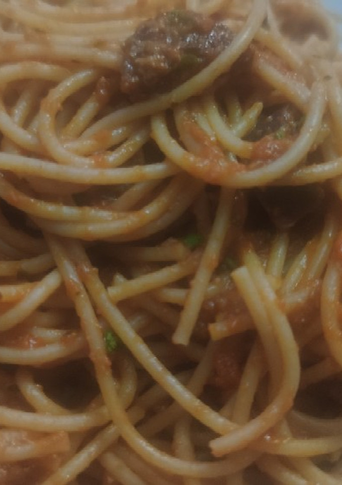 Una foto de Espaguetis integrales con salsa de tomate y ricota