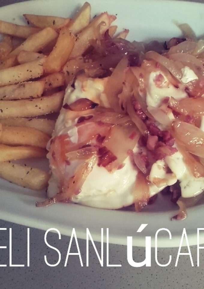 Una foto de Huevos encebollados con jamón