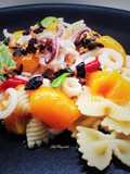 Farfalle con salsa di alici, calamari e terra di olive taggiasche e cipolla