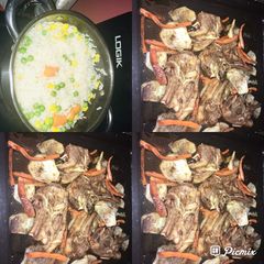 A picture of Grilled Lamb chops with potatoes and carrot including rice with veggies.