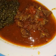 Managu,served with beef stew and ugali A picture of Managu,served with beef stew and ugali.