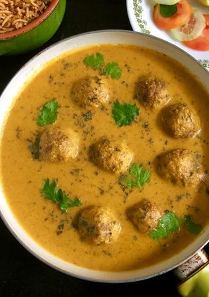 A picture of Gobhi Koftas in Carrot Sauce.