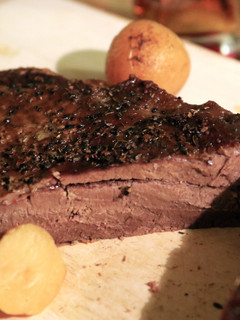 A picture of Bison Brisket with Roasted Potatoes & Gravy.