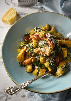 A picture of Homemade Gnocchi With Chicken Sausages In A Creamy Spinach Sauce.