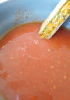 A picture of Roast tomato soup with pesto and grilled cheese toasties.