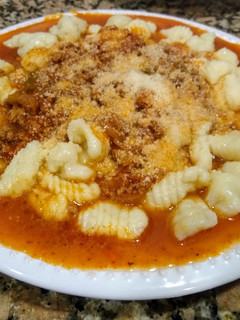 Una foto de Ñoquis con salsa Boloñesa