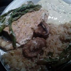 A picture of Foil Wrapped Salmon with Rice & Asparagus.