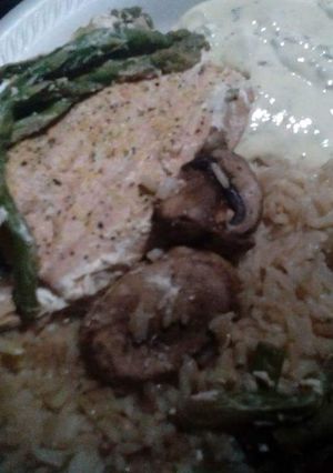A picture of Foil Wrapped Salmon with Rice & Asparagus.