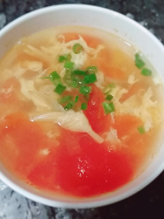 A picture of Tomatoes egg drop soup.