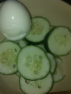 A picture of Boiled egg with cucumber.