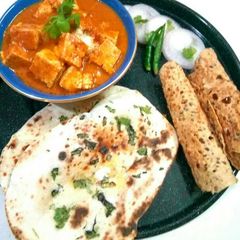 A picture of Paneer tikka,butter naan and papad.
