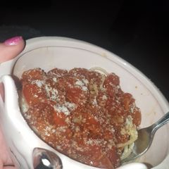 A picture of Slow Cooker Balsamic Tomatoes with spaghetti.