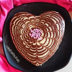 A picture of Valentine's special Vanilla Chocolate Heart Cake / Zebra cake / Eggless cake.
