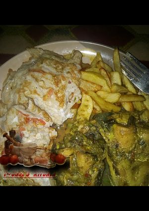 A picture of Chips and egg with Cat Fish pepper soup.