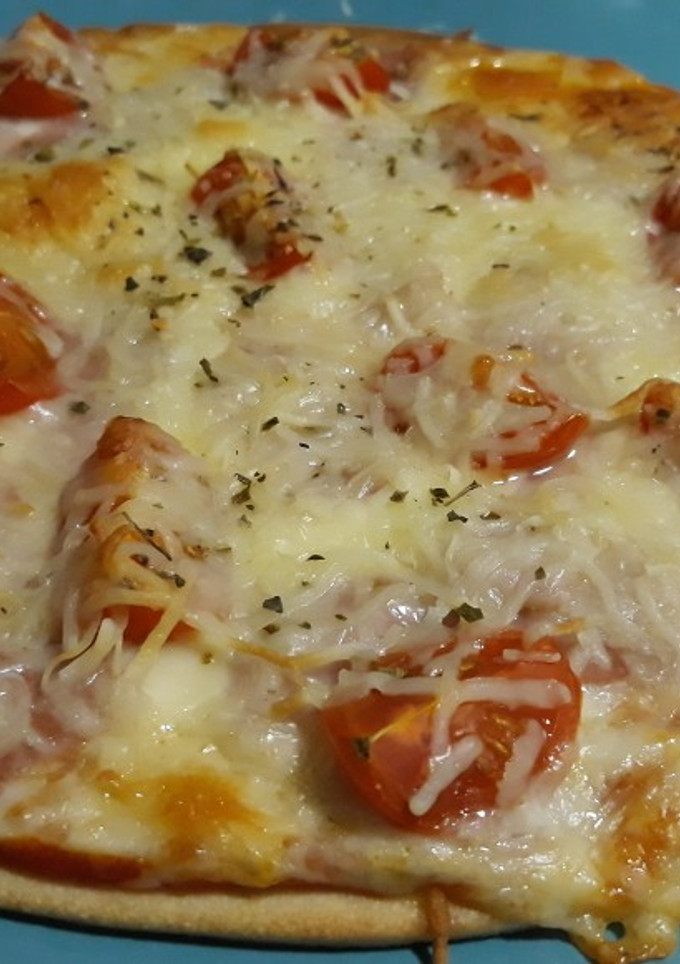 Una foto de Pizza con queso