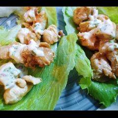 Chicken wrapped in lettuce with tartar sauce and mozzarella A picture of Chicken wrapped in lettuce with tartar sauce and mozzarella.