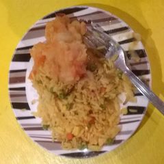A picture of Mash potatoes with carrot.