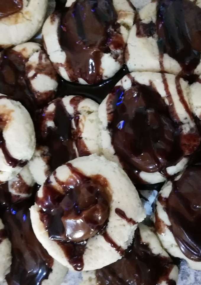 Una foto de Galletita estilo pepas de dulce de leche 😋😋😋