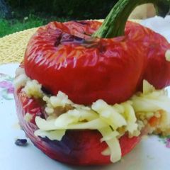 A picture of Couscous filled red bell peppers.