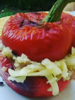 A picture of Couscous filled red bell peppers.