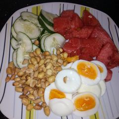 A picture of Fruits + groundnut + boiled eggs.