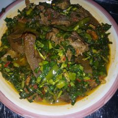A picture of Scent leaf, and Water leaf soup.