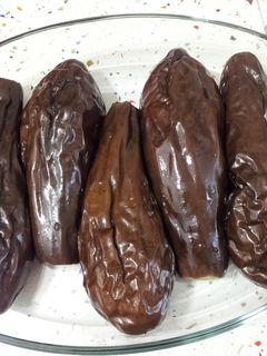 Una foto de Berenjenas y pimientos en papillot