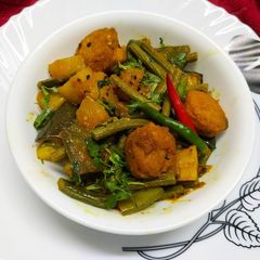 Drumstick Curry with Mixed Vegetables and Lentil Fritters A picture of Drumstick Curry with Mixed Vegetables and Lentil Fritters.