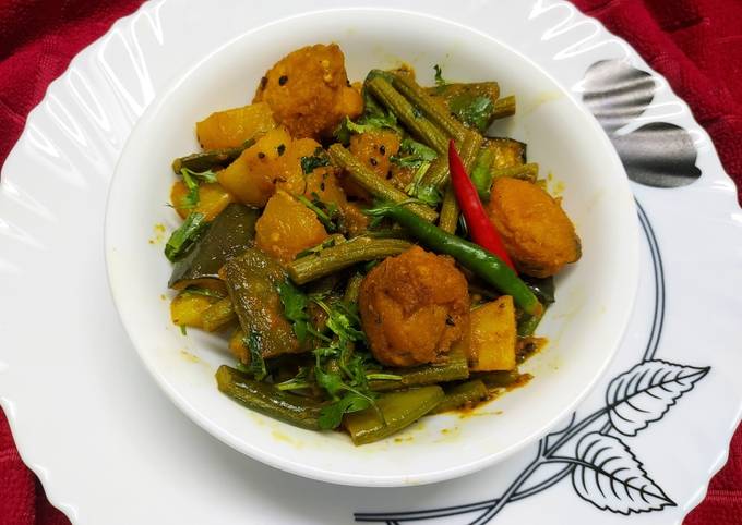 Drumstick Curry with Mixed Vegetables and Lentil Fritters