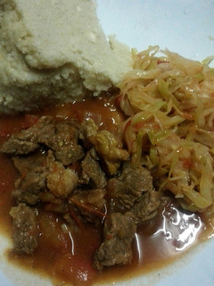 A picture of Beef Stew Cabbage and Ugali.