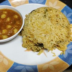 A picture of Tomato Rice with Chole masala.