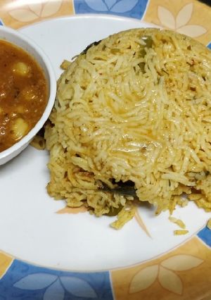 A picture of Tomato Rice with Chole masala.