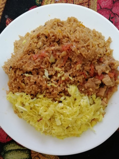 A picture of Pilau and cabbage.
