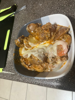 Una foto de Papas a la boloñesa