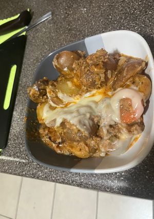 Una foto de Papas a la boloñesa