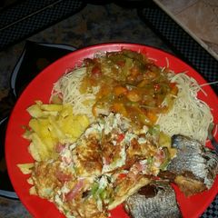 A picture of White ndles and veg. sauce with fried fish,Irish potato $scrmbl.