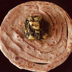 A picture of Alu meethi with paratha.