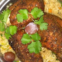 A picture of Vegetable rice with grilled boneless chicken.