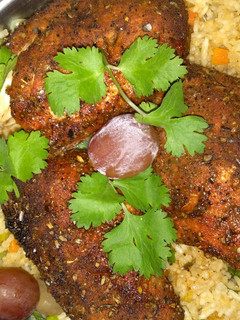 A picture of Vegetable rice with grilled boneless chicken.