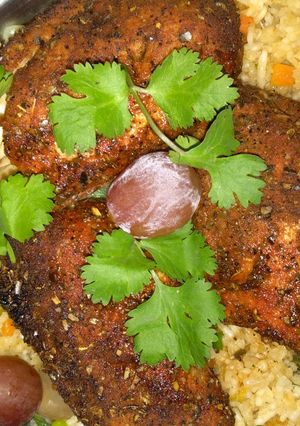 A picture of Vegetable rice with grilled boneless chicken.