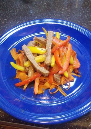 A picture of Pepper steak with "Coodles" aka carrot noodles.