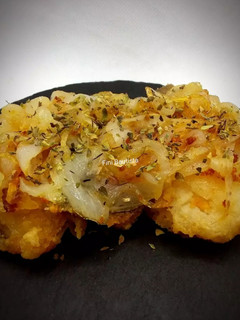 Una foto de Bacalao con cebolla y orégano