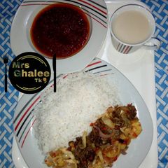 A picture of Rice and stew with irish sauce and pap.