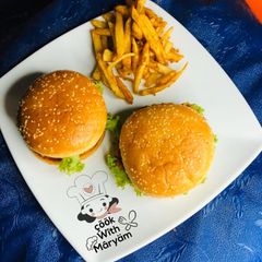 A picture of Zinger burger with fries.