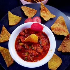 A picture of Indian style simple Salsa nachos.