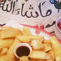 A picture of Casava with sauce and onion ralish.