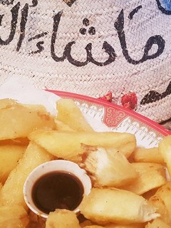 A picture of Casava with sauce and onion ralish.