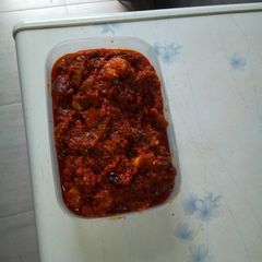 A picture of Fresh tomatoes stew with goat meat.