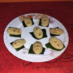 Oyster design desiccated coconut sandesh A picture of Oyster design desiccated coconut sandesh.