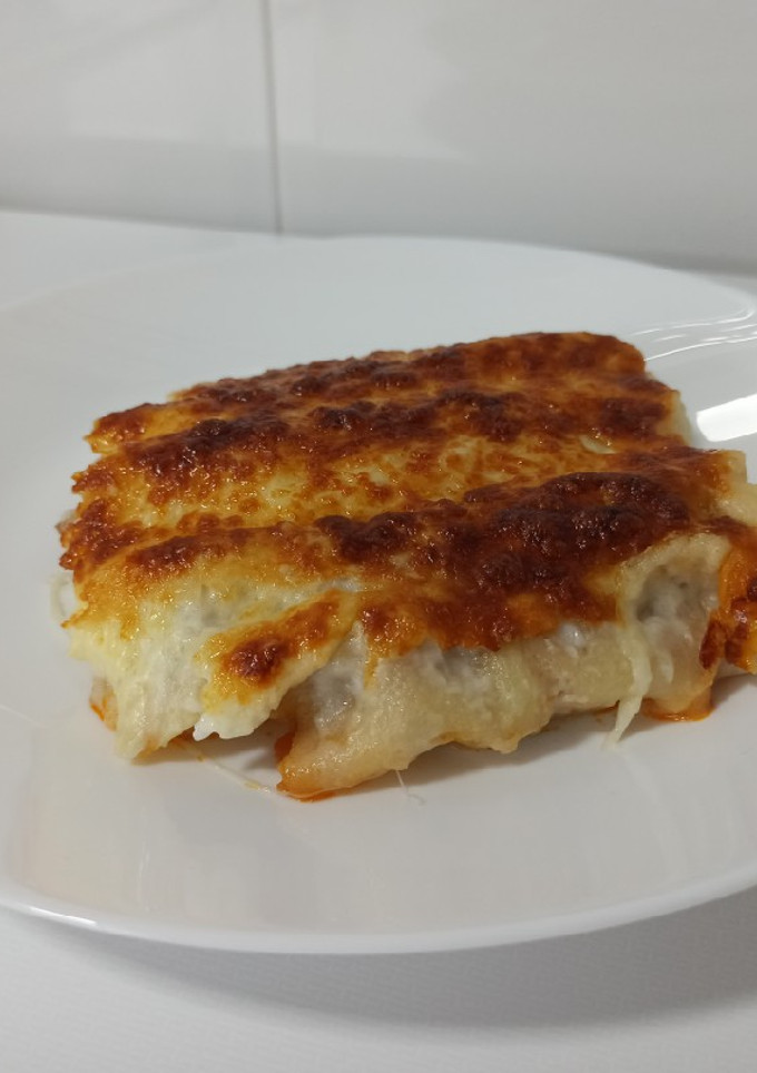 Una foto de Canelones de carne picada